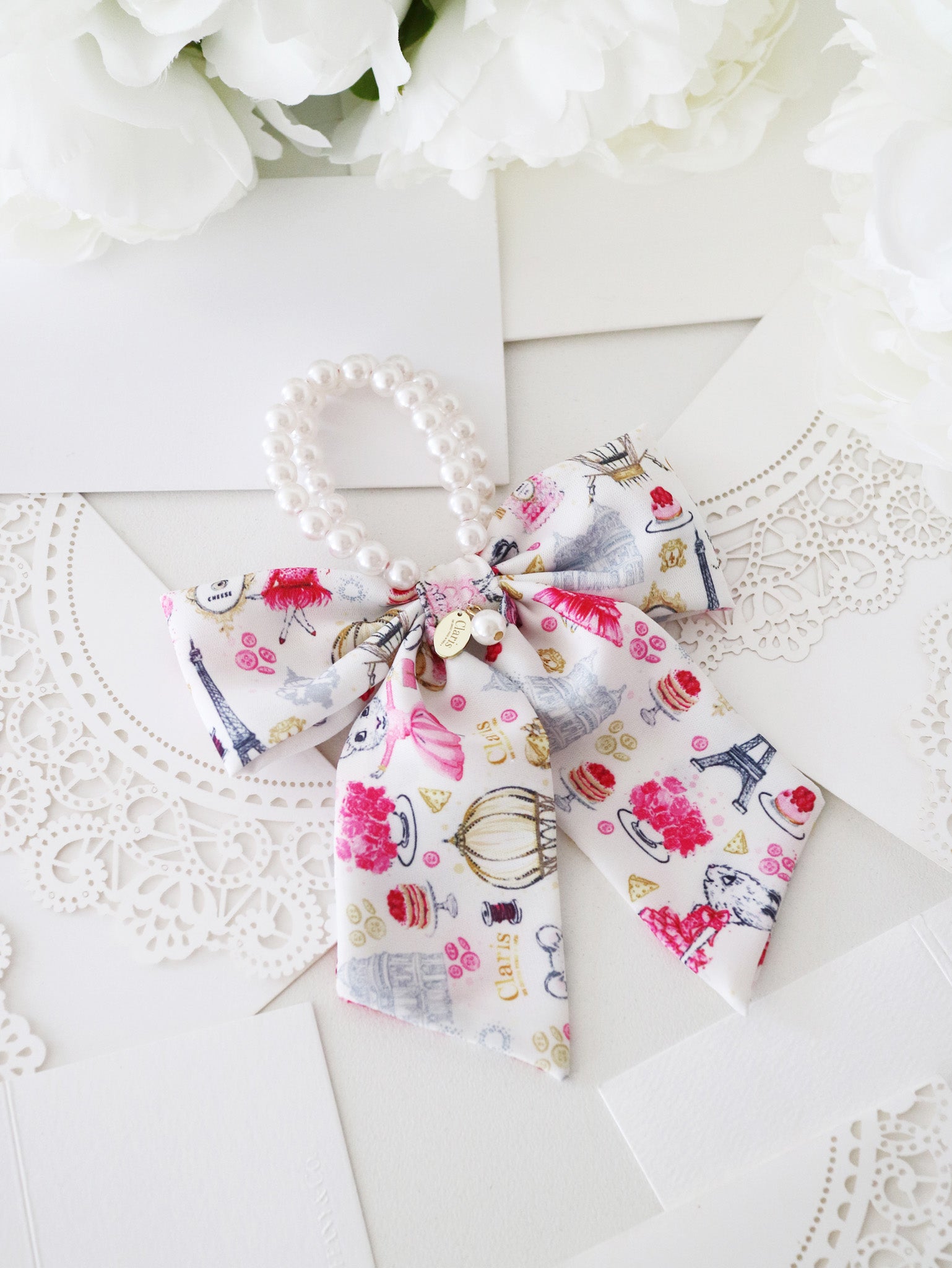 Claris: The Chicest Mouse In Paris™ Fashion Print and Pearl Hair Elastic with Bow - Pink Poppy Australia
